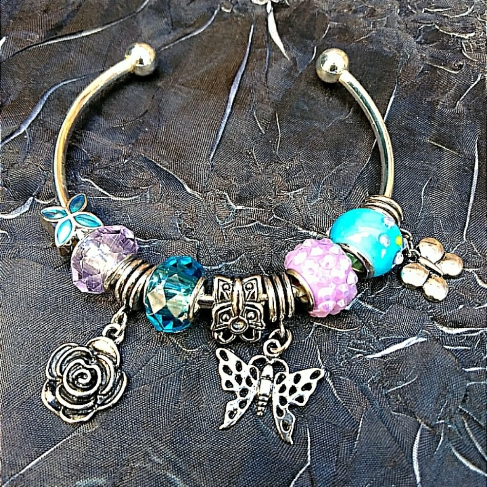 Silver bangle with beads & charms